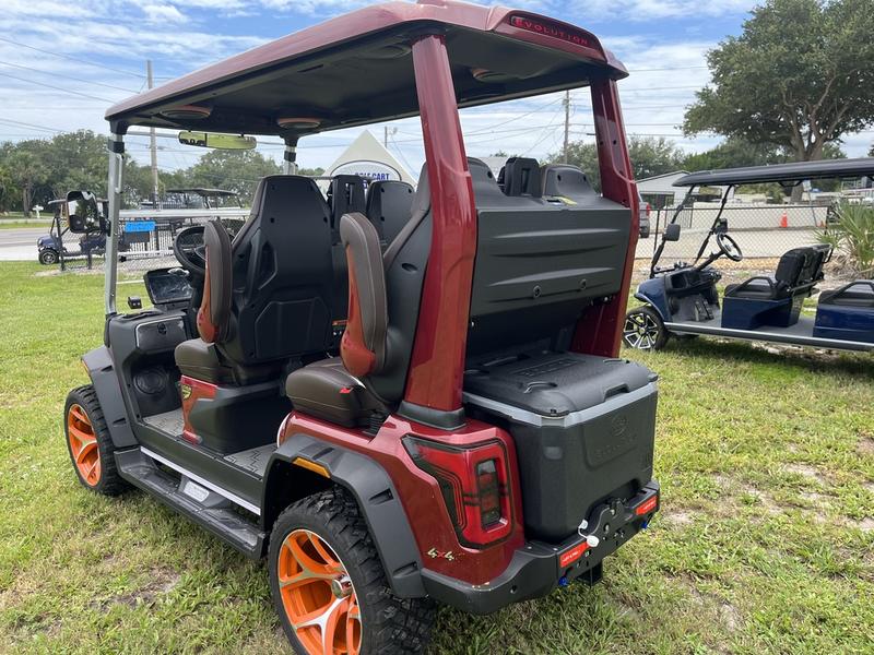 Cargo and utility section of 2025 Evolution D-Max XT4 red golf cart available in Texas