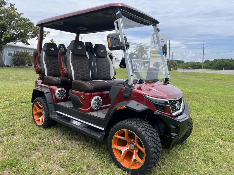 Front view of red 2025 Evolution D-Max XT4 electric golf cart available in Texas with nationwide delivery and export options