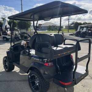 Side view of 2026 Club Car Onward Lifted 4 Passenger Gas golf cart with rugged tires