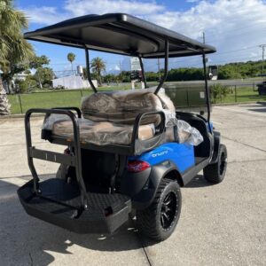 Side view of 2026 Club Car Onward Lifted 4 Passenger Gas blue golf cart in North Carolina