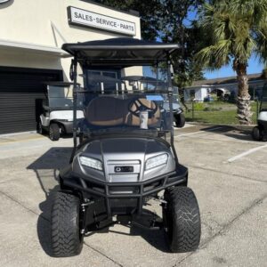 Side view of 2026 Club Car Onward Lifted 4 Passenger Gas grey golf cart in Texas